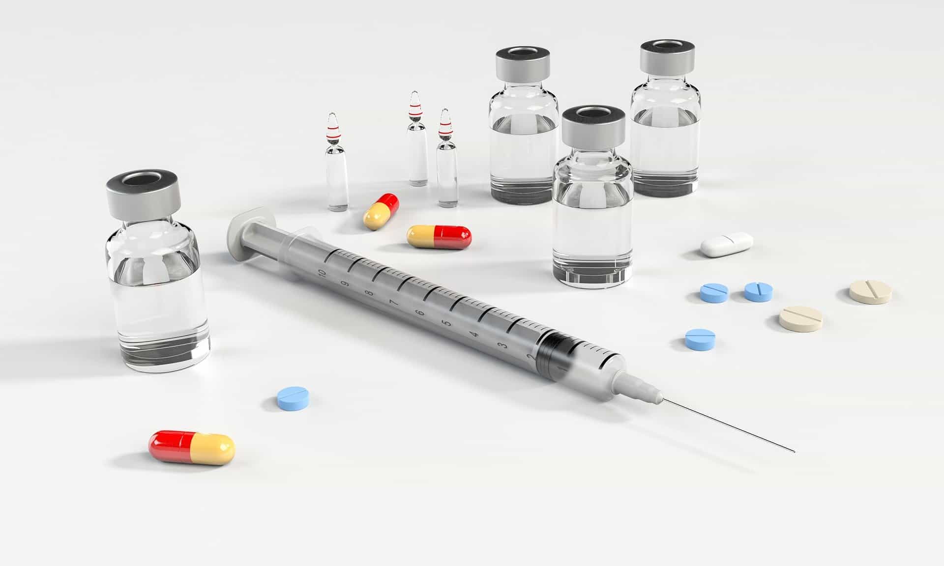 syringe and pills