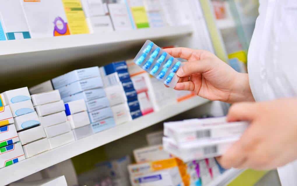pharmacist dispensing prescription drugs
