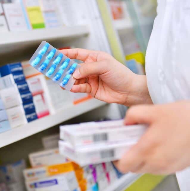 pharmacist dispensing prescription drugs sq
